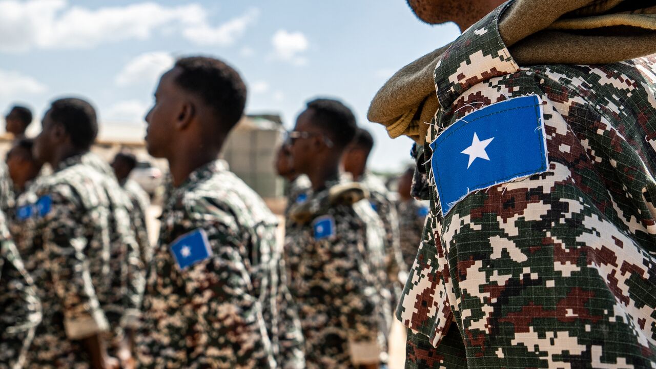 A Somali National Army soldier stands at attention during the morning briefing for trainee officers at the General Dhagabadan Training Centre in Mogadishu on March 19, 2024.