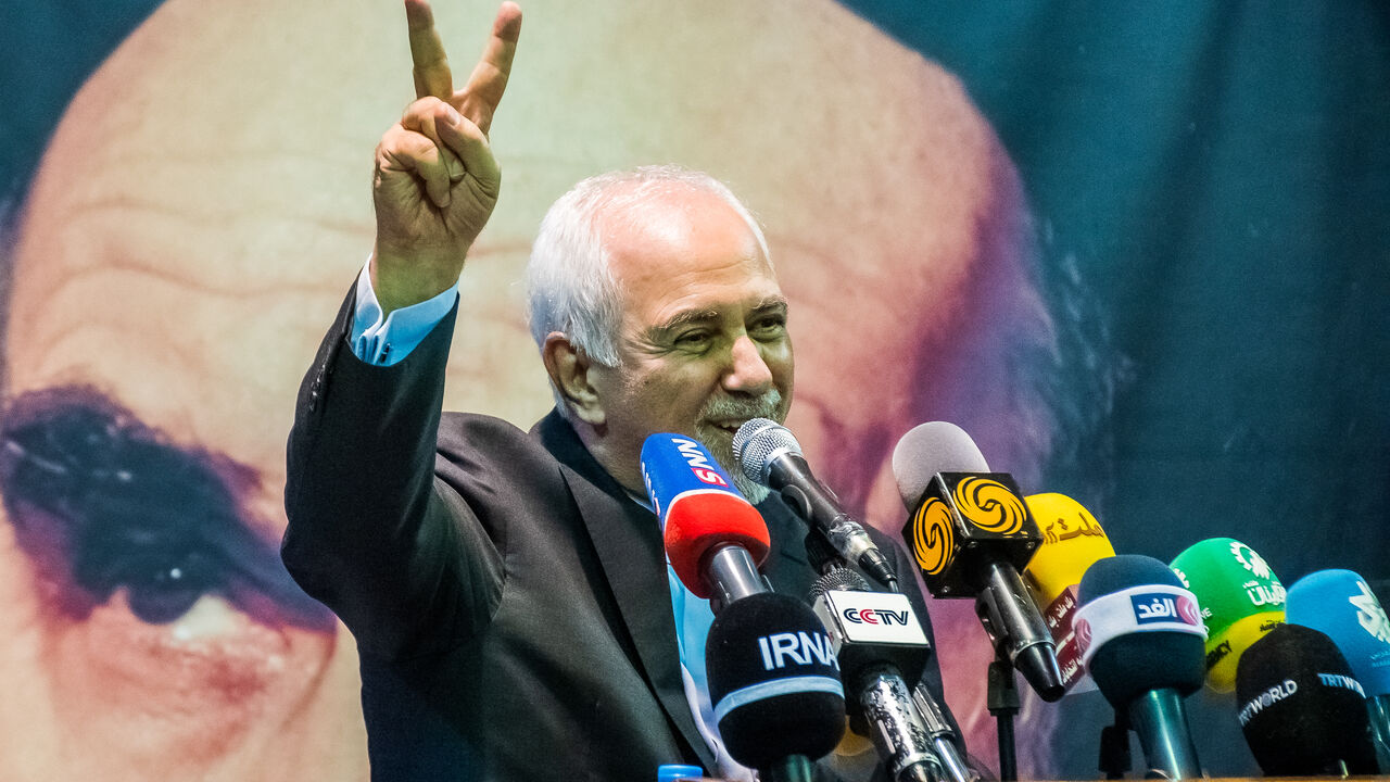 Mohammad Javad Zarif, the former Iranian Foreign Minister, flashes victory sign during an election rally in support of  Iranian presidential election candidate Masoud Pezeshkian in Tehran, Iran, on June 24, 2024. Iran is holding snap presidential elections to choose the next president after the death of Ebrahim Raisi in a helicopter crash. After the election with a historically low turnout on Friday, Masoud Pezeshkian, Iran's presidential election candidate and former reformist member of the Iranian parliam