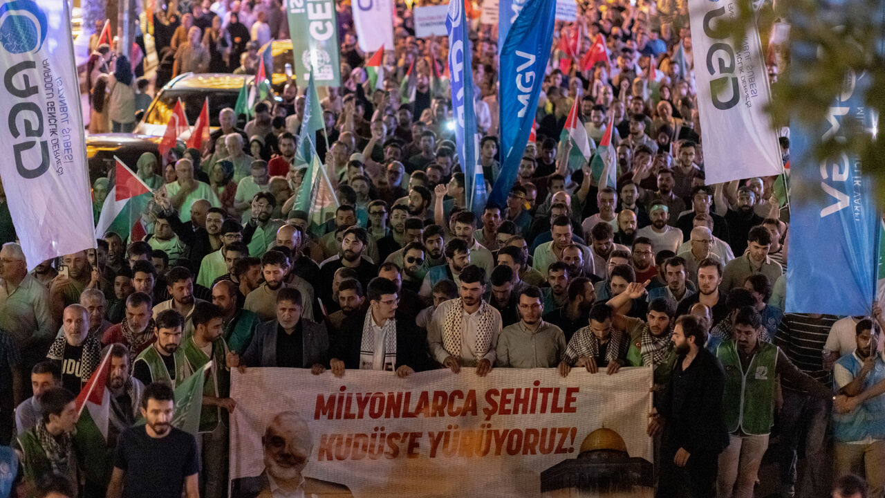 Pro-Palestinian demonstrators wave Palestinian flags as they take part in a rally to protest the death of the Hamas leader Ismail Haniyeh, following evening prayers in Fatih district of Istanbul on July 31, 2024.