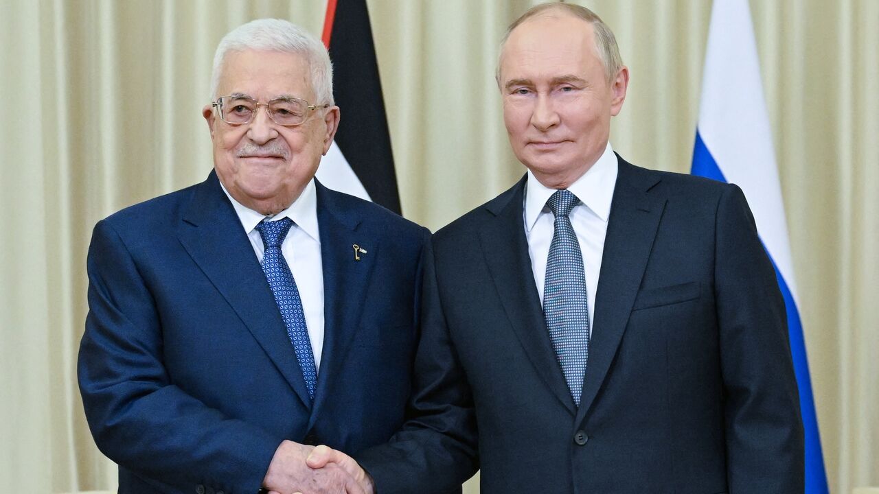 In this pool photograph distributed by Russian state owned Sputnik agency Russia's President Vladimir Putin (R) meets Palestinian Authority President Mahmud Abbas in Novo-Ogaryovo, outside Moscow on August 13, 2024.