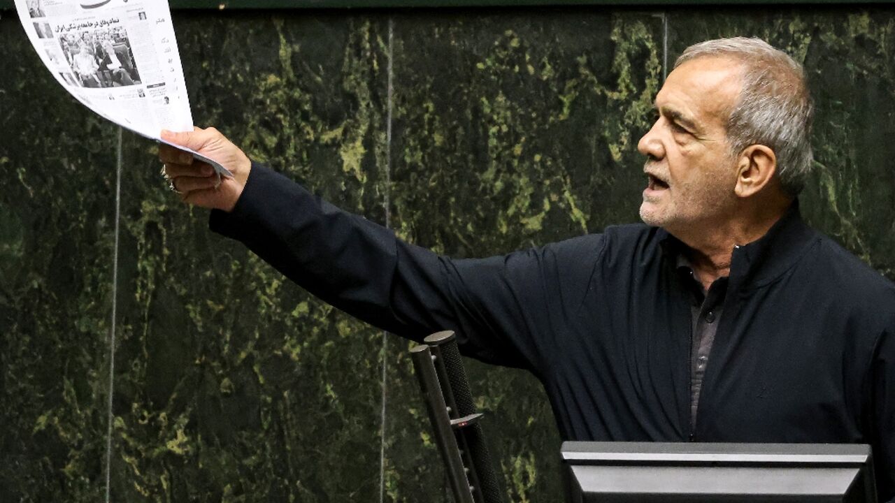 Iran's President Masoud Pezeshkian addresses parliament during a session to approve his new cabinet Iran's President Masoud Pezeshkian addresses parliament during a session to approve his new cabinet