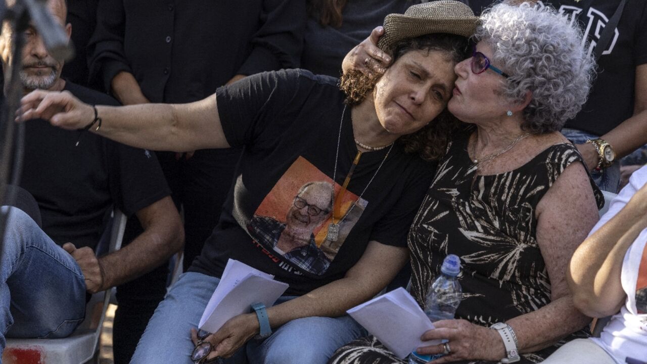 Ruti and Keren Munder mourn husband and father Avraham Munder who was taken hostage by Palestinian militants during their October 7 attack on Israel Ruti and Keren Munder mourn husband and father Avraham Munder who was taken hostage by Palestinian militants during their October 7 attack on Israel