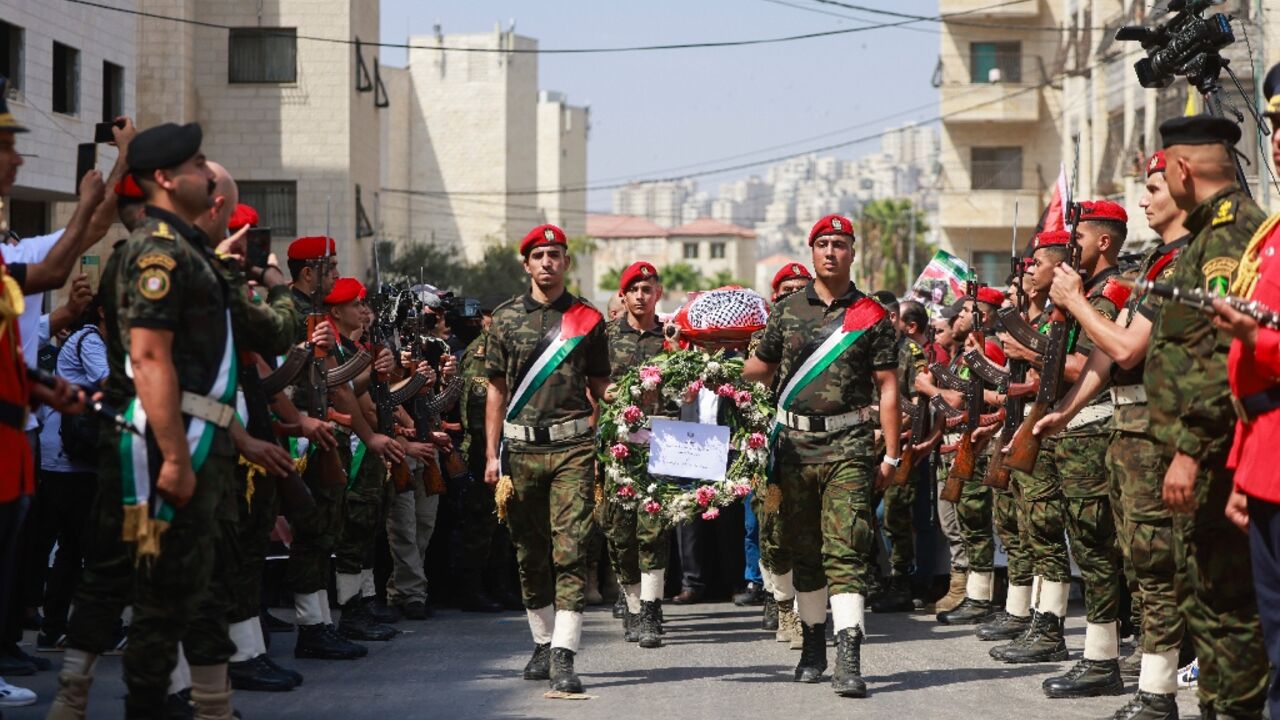 Palestinian security forces carry the body of slain Turkish-American activist Aysenur Ezgi Eygi during a funeral procession in Nablus, in the Israeli-occupied West Bank