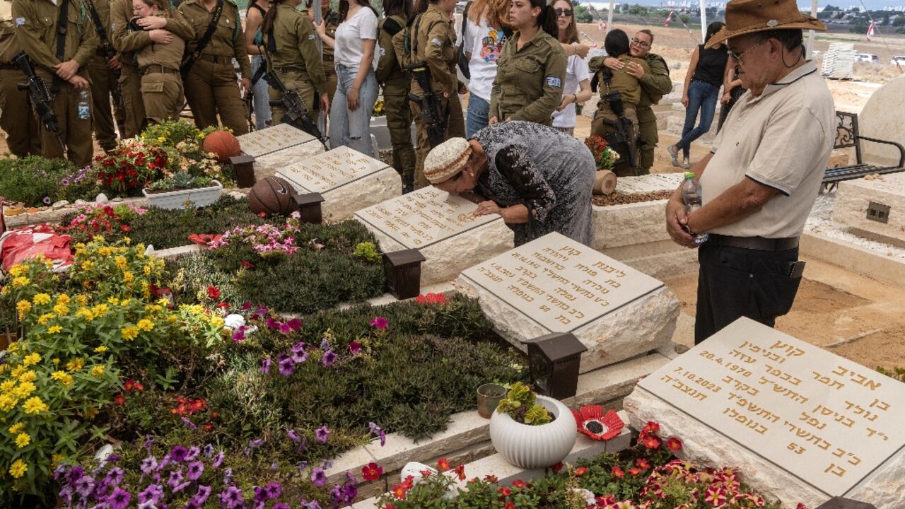 Relatives and friends attend memorial ceremony for the Kutz family who were killed when Hamas militants stormed southern Israel on October 7, 2023 Relatives and friends attend memorial ceremony for the Kutz family who were killed when Hamas militants stormed southern Israel on October 7, 2023