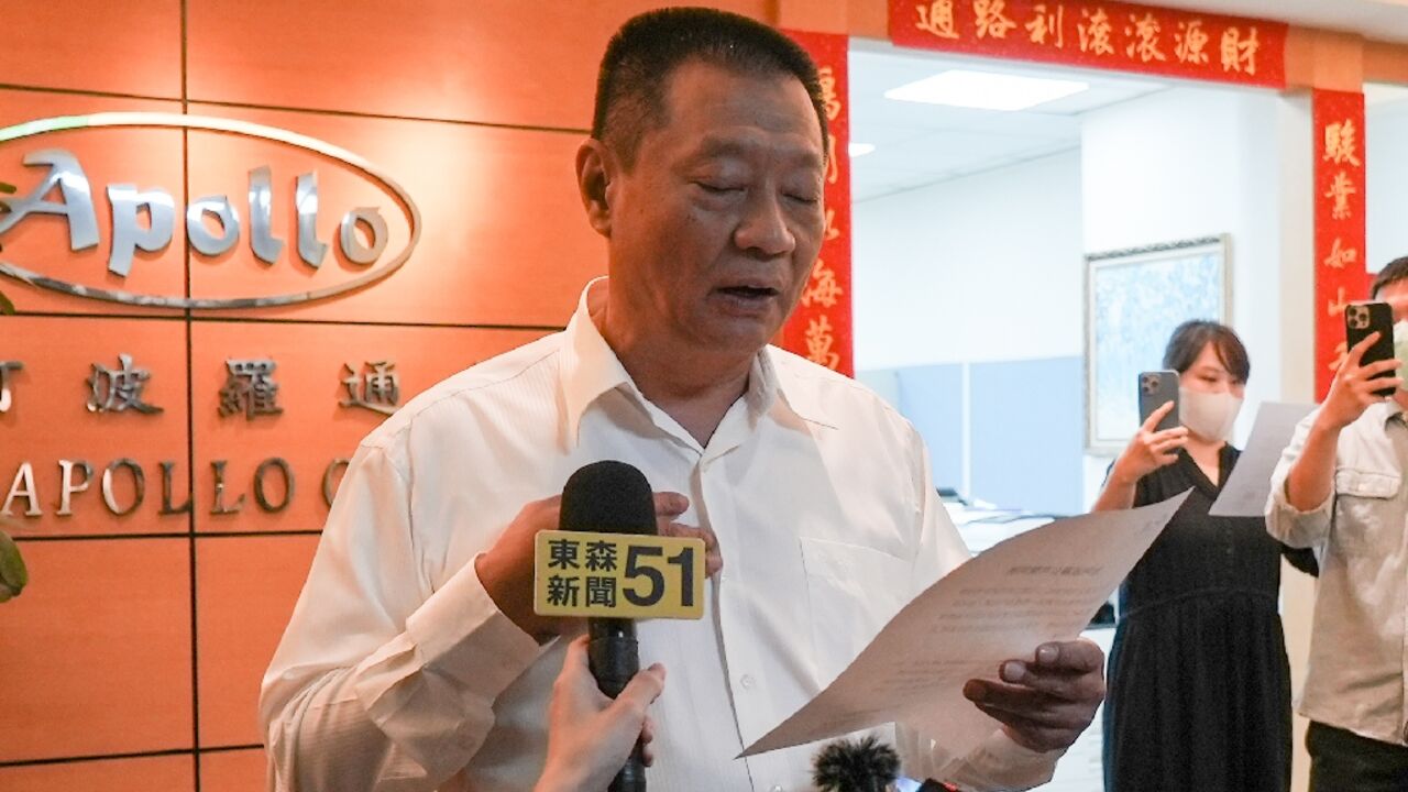 Gold Apollo chief Hsu Ching-kuang  speaks to the media outside the company's office in New Taipei City