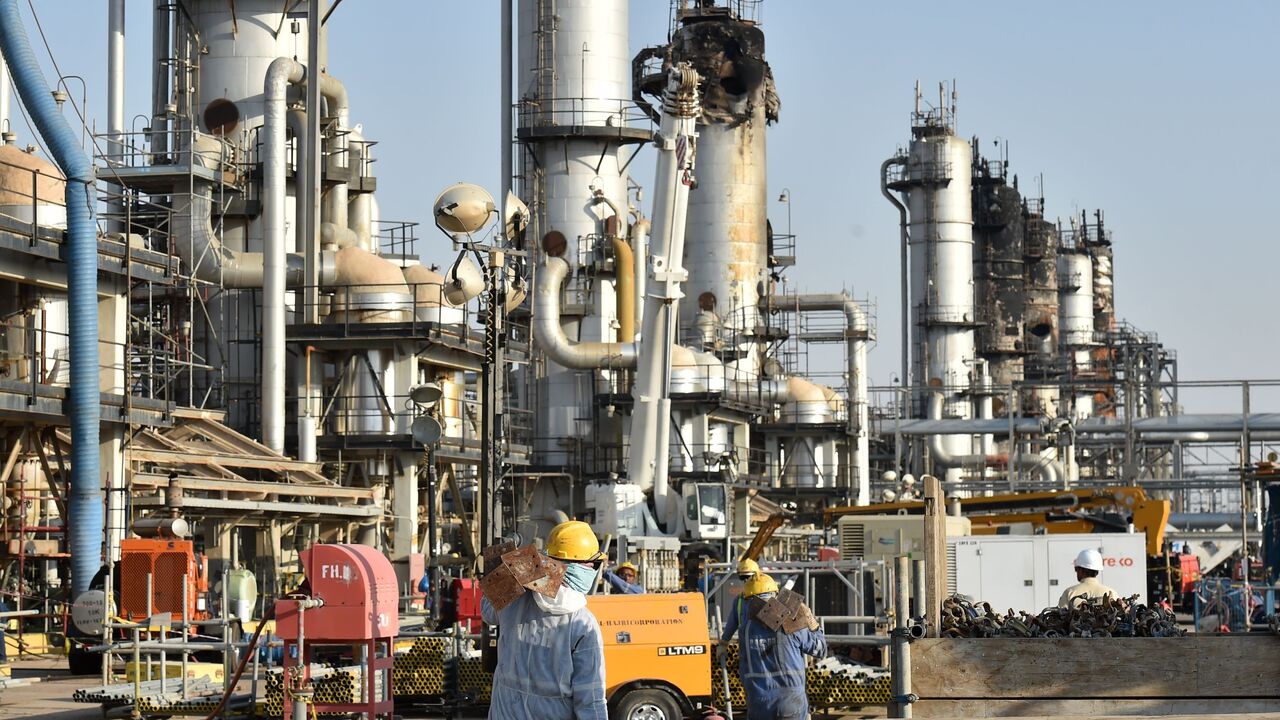 Employees of Aramco oil company work in Saudi Arabia's Abqaiq oil processing plant on September 20, 2019.