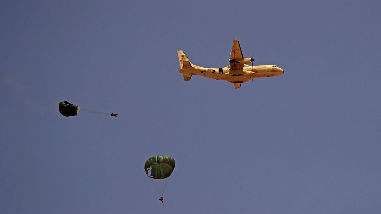 Paratroopers jump off an Egyptian C-130 Hercules military plane during the "Guardians of the Nile" joint military drill between Egypt and Sudan in the Um Sayyala area, northwest of Khartoum, on May 31, 2021. 