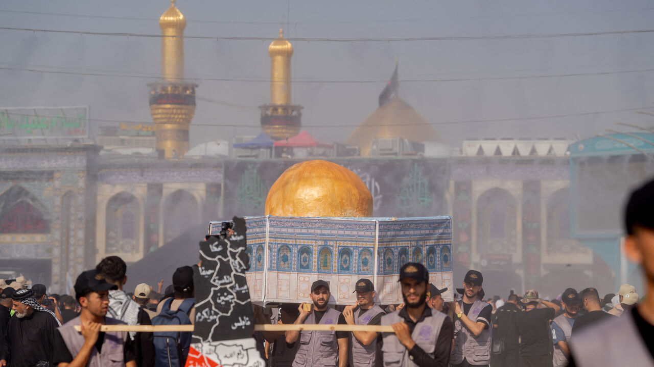 Shiite Muslim devotees attend mourning rituals in Iraq's central holy shrine city of Karbala on August 23, 2024 ahead of the Arbaeen commemorations that mark the end of the 40-day mourning period for the seventh century killing of the Prophet Mohamed's grandson Imam Hussein ibn Ali. (Photo by Ali Abdul Wahid / Middle East Images / Middle East Images via AFP) (Photo by ALI ABDUL WAHID/Middle East Images/AFP via Getty Images)