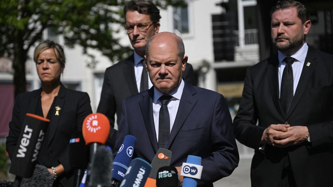 German Chancellor Olaf Scholz addresses media after a visit at the site of a knife attack in Solingen, Western Germany, on August 26, 2024. 