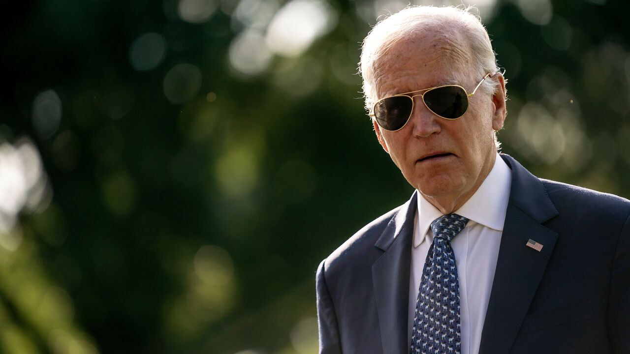 US President Joe Biden walks across the South Lawn while returning to the White House from Delaware on September 2, 2024, in Washington, DC. 