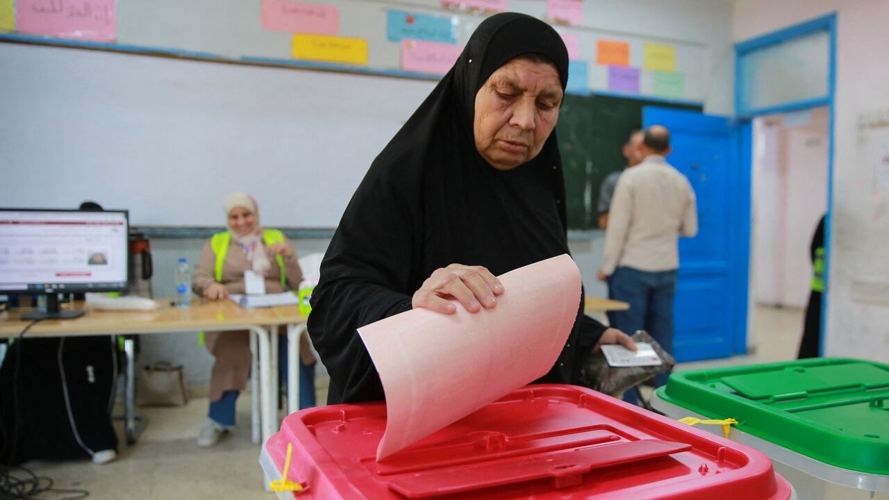 An elderly Jordanian woman votes in parliamentary elections at a polling station at the al-Baqaa Palestinian refugee camp near the capital Amman on September 10, 2024.