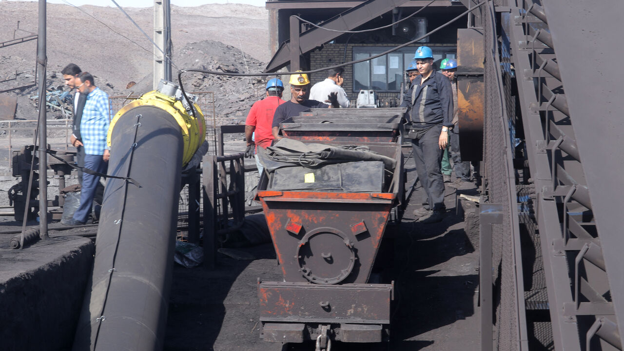 Iranian miners look on at the scene of a blast at a coal mine in Tabas in Iran's Khorasan province on September 22, 2024. The blast caused by a gas leak at the coal mine in eastern Iran has killed at least 50 people, state media said on September 22, in one of Iran's deadliest work accidents in years. (Photo by Mohsen NOFERESTY / IRNA / AFP) (Photo by MOHSEN NOFERESTY/IRNA/AFP via Getty Images)