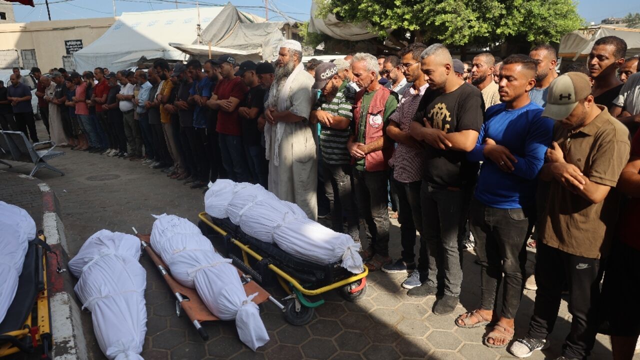 Palestinians mourn over the bodies of victims of Israeli bombardment in Deir el-Balah in central Gaza Palestinians mourn over the bodies of victims of Israeli bombardment in Deir el-Balah in central Gaza