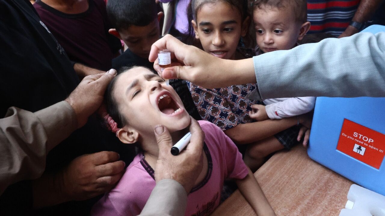 Palestinian children receive drops as part of a polio vaccination campaign in Deir al-Balah in the central Gaza Strip Palestinian children receive drops as part of a polio vaccination campaign in Deir al-Balah in the central Gaza Strip