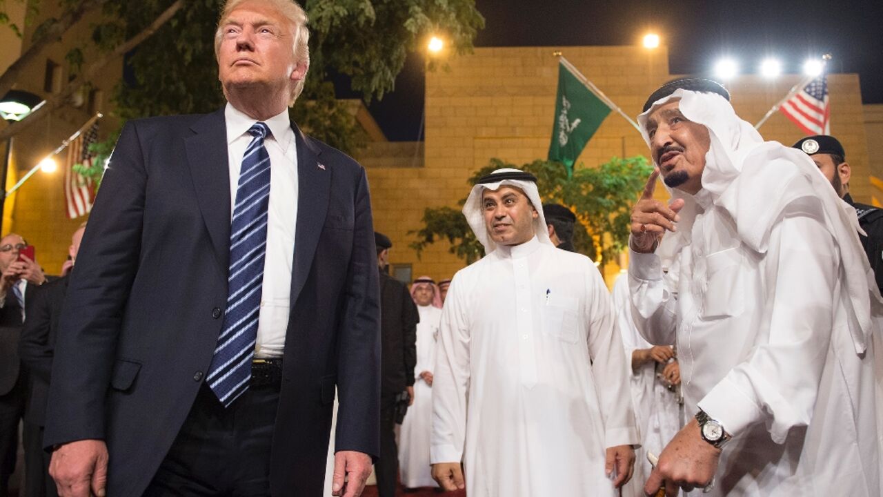 Then-US President Donald Trump (L) flew to meet Saudi Arabia's King Salman bin Abdulaziz al-Saud (R) on his first official visit in 2017