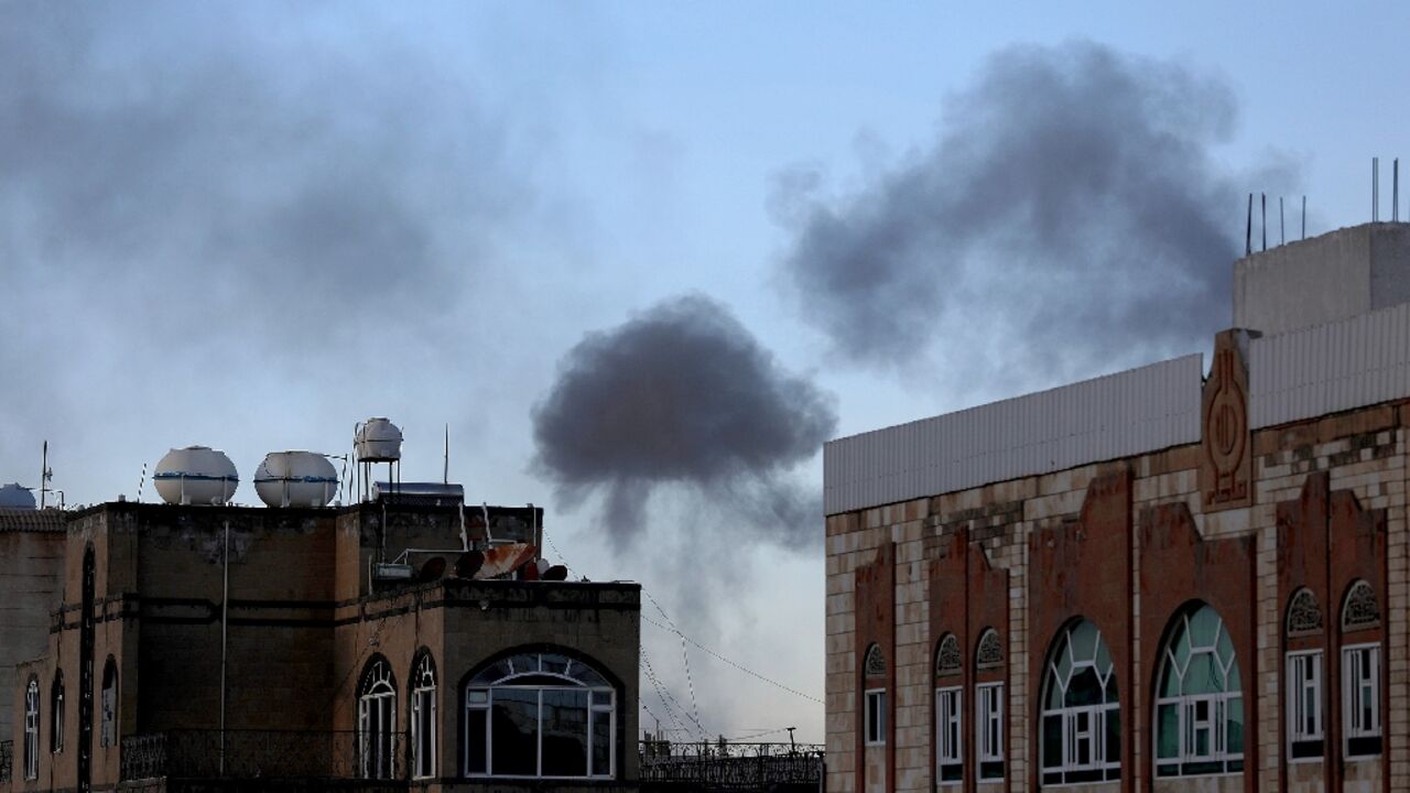 Smoke billows in the Yemeni capital of Sanaa following US military strikes aimed at Huthi targets on October 4, 2024