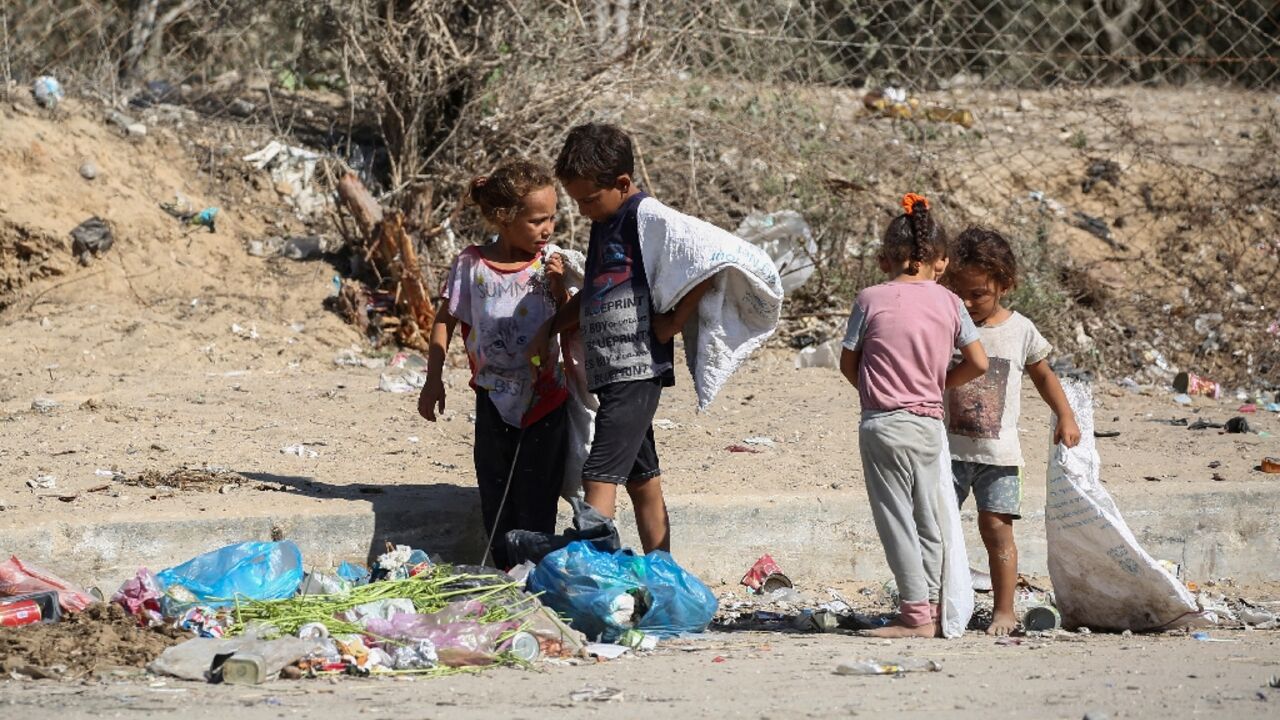 Palestinian children salvage items from garbage central Gaza Palestinian children salvage items from garbage central Gaza