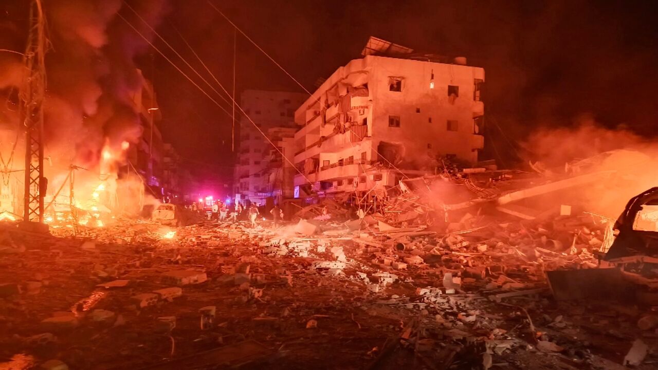 First responders work amid fire and destruction after an Israeli air strike in the southern Lebanese village of Abbasiyeh near Tyre First responders work amid fire and destruction after an Israeli air strike in the southern Lebanese village of Abbasiyeh near Tyre