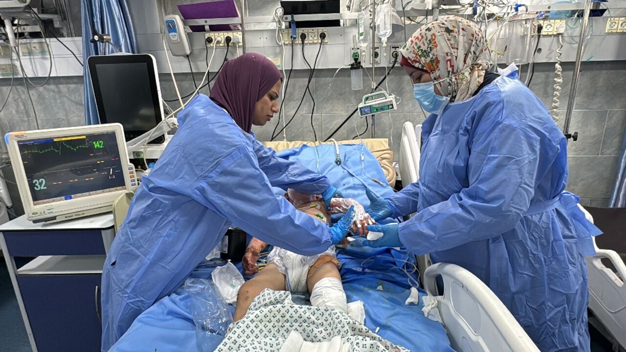 A wounded Palestinian child receives treatment in the emergency room at north Gaza's Kamal Adwan Hospital the day before Israeli troops raided it and detained those still inside