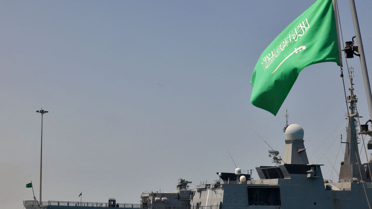 A Saudi navy ship is pictured docked at King Faisal navy base in Jeddah before the departure of a team to Port Sudan to help with the evacuation efforts of people fleeing Sudan, on April 29, 2023. - Warplanes on bombing raids drew heavy anti-aircraft fire over Khartoum as fierce fighting between Sudan's army and paramilitaries entered a third week, despite a renewed truce. (Photo by Fayez NURELDINE / AFP) (Photo by FAYEZ NURELDINE/AFP via Getty Images)