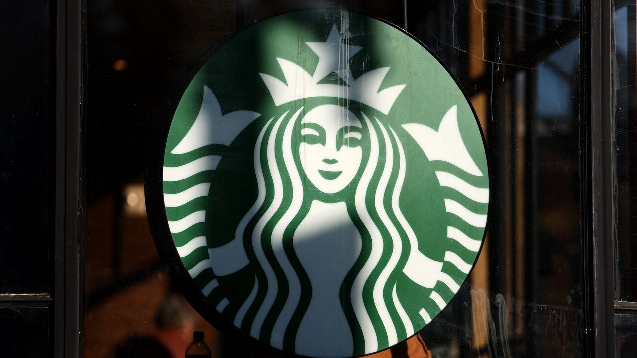 A Starbucks logo is seen as members and supporters of Starbucks Workers United protest outside of a Starbucks store in Dupont Circle on Nov. 16, 2023, in Washington. 