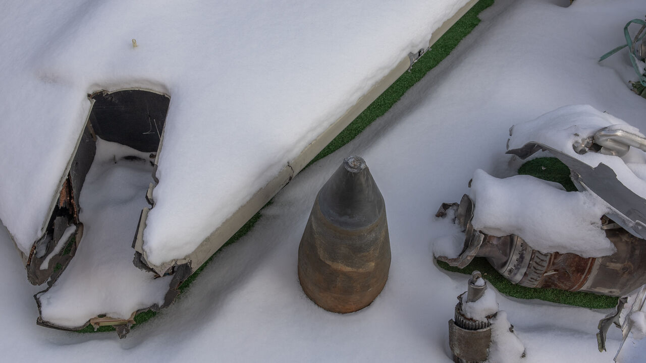 This photograph taken on January 16, 2024, shows partly covered in snow the wreckage of Iranian made Shahed drone launched at Ukraine, at Kyiv Scientific Research Institute of Forensic Expertise, in Kyiv, amid the Russian invasion of Ukraine. At a research facility in Kyiv, forensic experts pour over the wreckage of missiles, working to confirm that despite unprecedented sanctions, Russia is still using imported components to attack Ukraine. The courtyard of the Kyiv Scientific Research Institute of Forensi