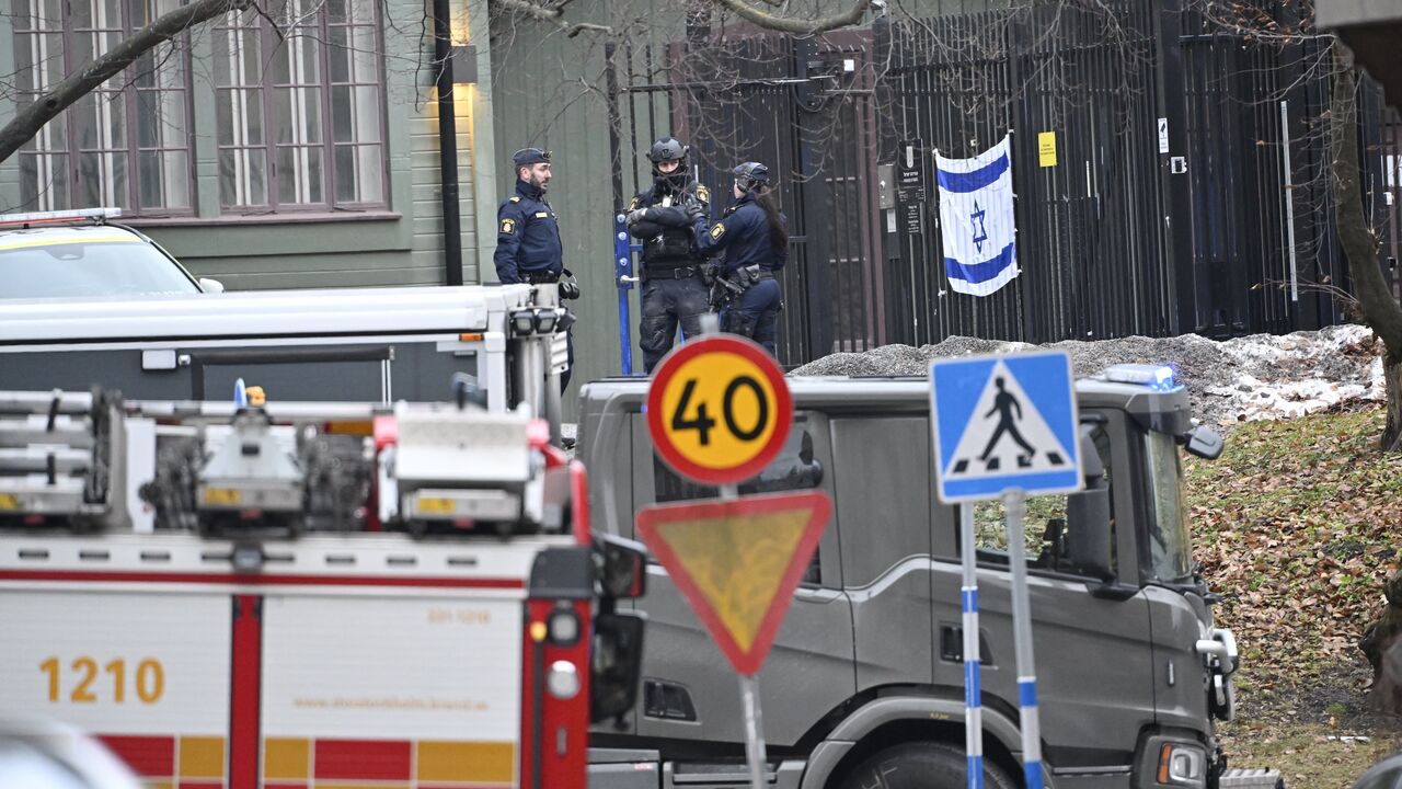 Police officers are seen outside the Israeli embassy in Stockholm, Jan. 31, 2024. 