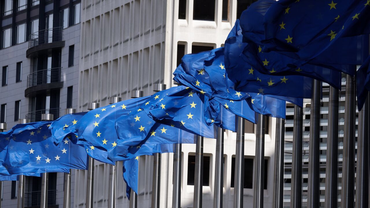 European Union flags fly outside the European Commission building in Brussels on April 12, 2024. 