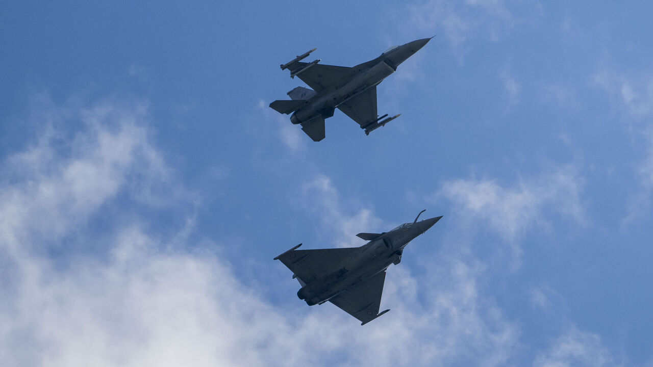 A Dassault Rafale C (below) and an F-16 Fighting Falcon combat airplane perform maneuvers over Ramstein Air Base during a day of fighter plane exercises on June 06, 2024 in Ramstein-Miesenbach, Germany. 