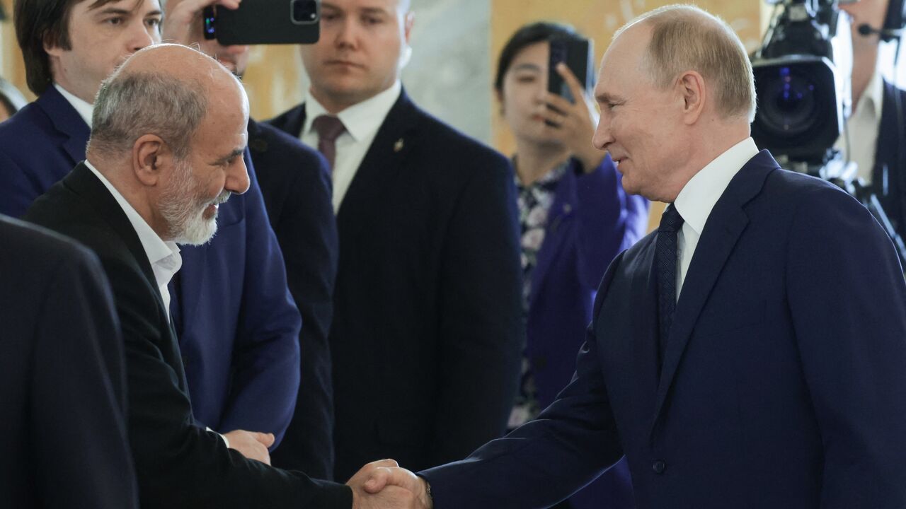 Russia's president, Vladimir Putin, shakes hands with Ali Akbar Ahmadian, secretary of Iran's Supreme National Security Council on Sept. 12, 2024. 