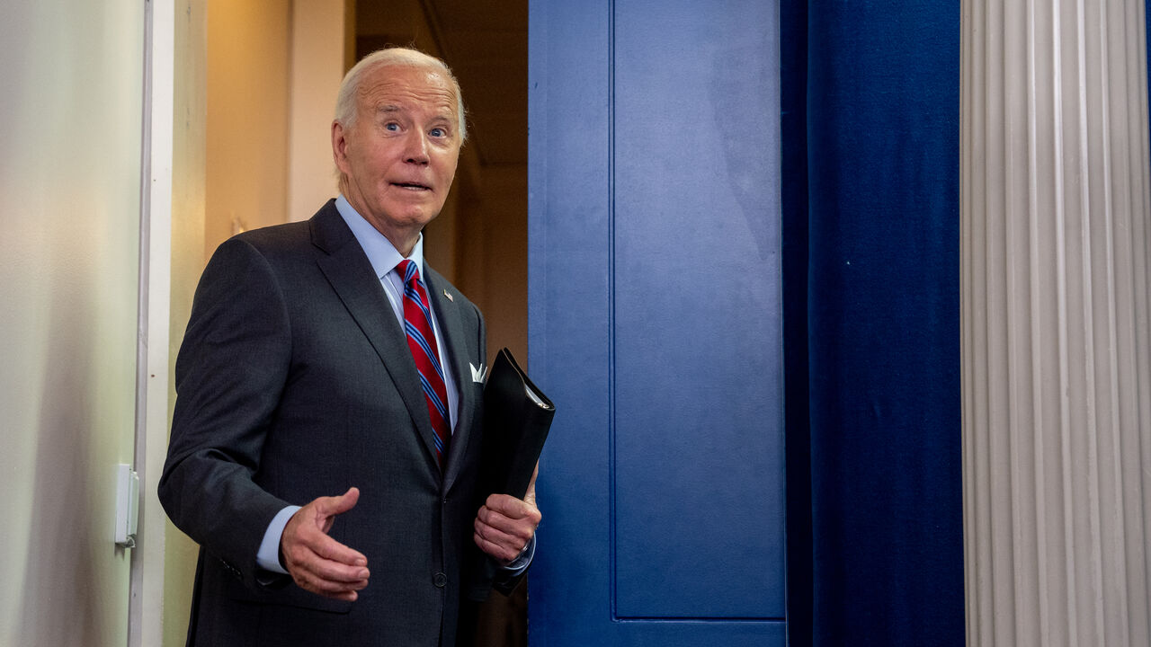 WASHINGTON, DC - OCTOBER 4: U.S. President Joe Biden turns around to joke with a reporter as he leaves a news conference in the Brady Press Briefing Room at the White House on October 04, 2024 in Washington, DC. Biden made a surprise appearance, his first in the briefing room since becoming president, to tout a positive job report and take questions from reporters. (Photo by Andrew Harnik/Getty Images)