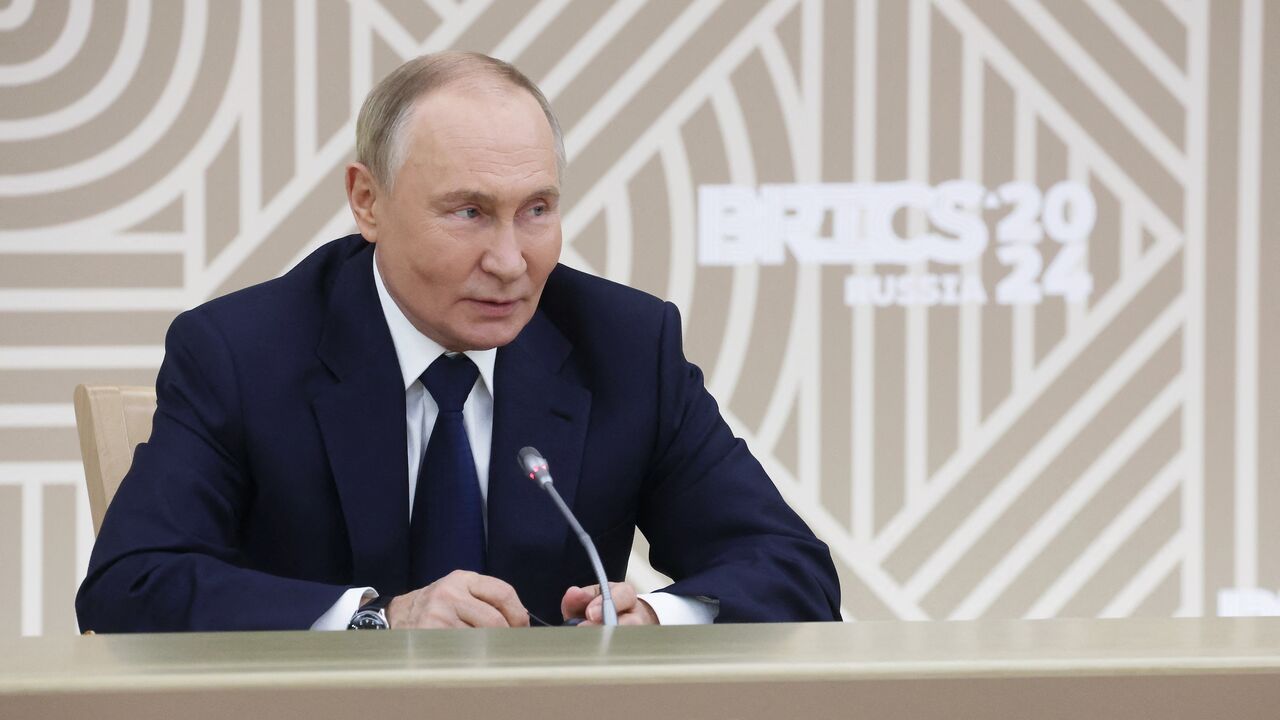 Russia's President Vladimir Putin meets with the heads of leading media outlets from the BRICS member countries in the Moscow region, on Oct. 18, 2024.