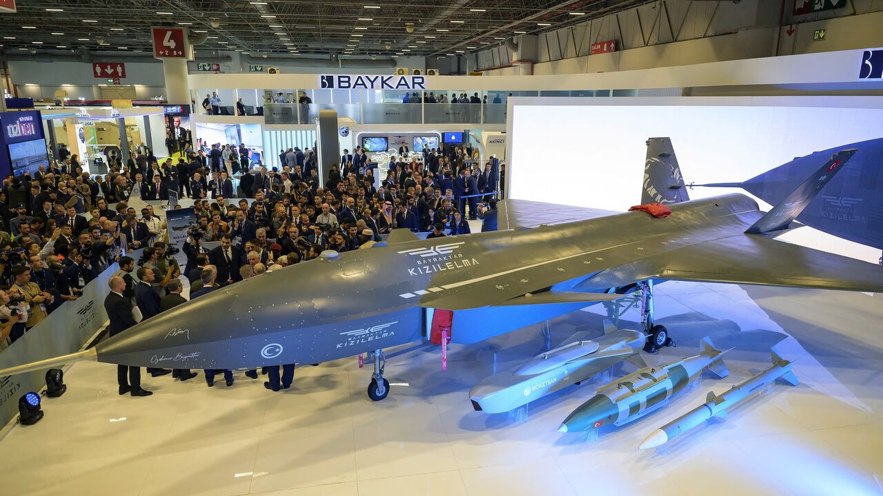 Visitors look at the Bayraktar Kizilelma UCAV during the opening day of SAHA EXPO 2024, an international defense and aerospace exhibition, Istanbul, Oct. 22, 2024.