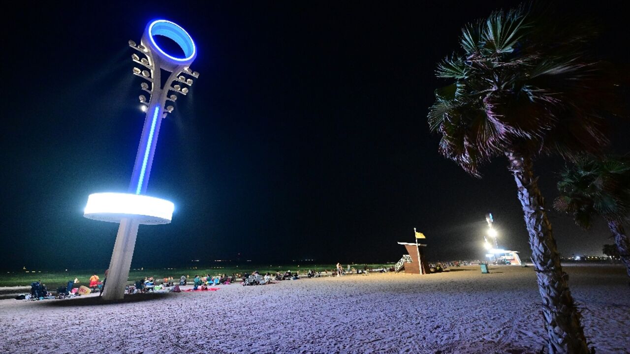 Floodlights illuminate the Umm Suqeim beach in Dubai to make it safer for beachgoers at night when the scorching heat of the Gulf has abated