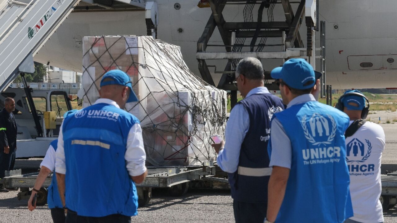 Staff unload a medical aid shipment at the Beirut International Airport