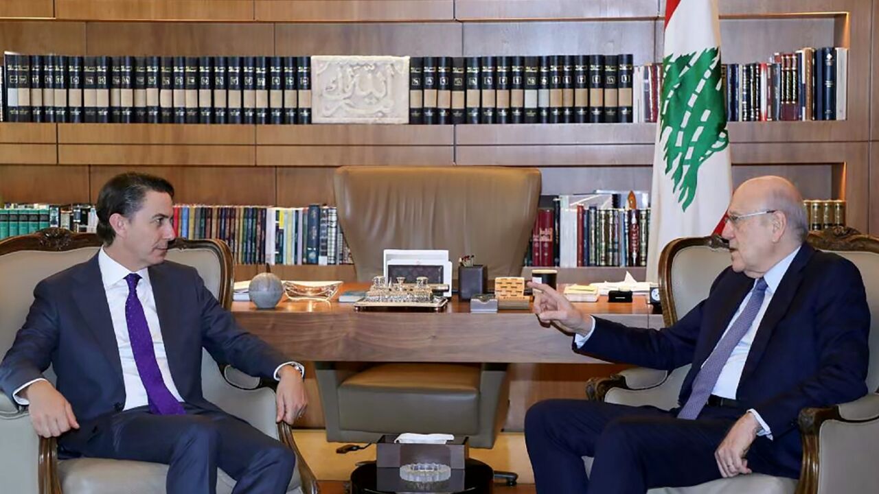 A handout picture provided by the Lebanese Prime Minister's press office shows Lebanese Prime Minister Najib Mikati meeting with US special envoy Amos Hochstein in Beirut