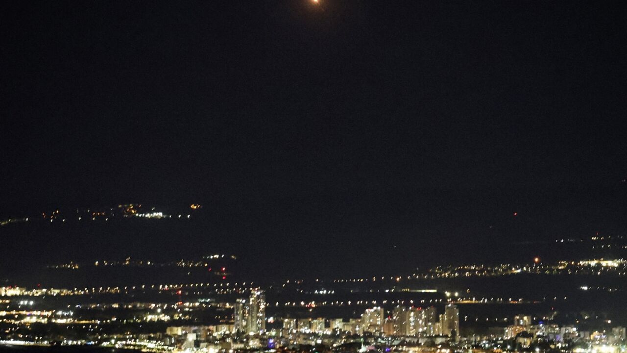 An explosion (top C) as Israel's Iron Dome air defence system intercepts rockets fired from Lebanon over Haifa An explosion (top C) as Israel's Iron Dome air defence system intercepts rockets fired from Lebanon over Haifa
