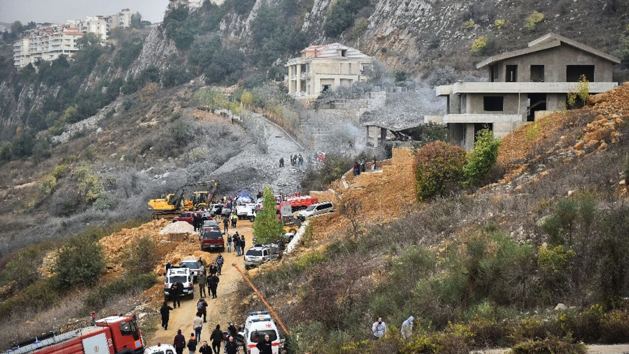 Rescuers rush to the site of the Israeli strike on Baalshmay in the mountains east of Beirut