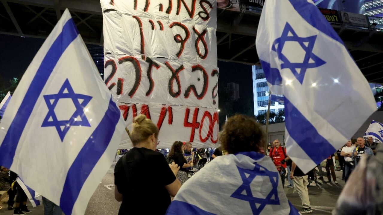 Many protesters held signs bearing including the figure 400 -- the number of days since the hostages were taken by Hamas