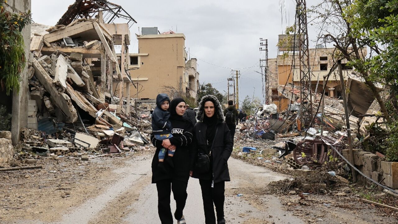 Residents walk amid the destruction in the southern Lebanese village of Zibqin after a ceasefire between Hezbollah and Israel allowed them to return home Residents walk amid the destruction in the southern Lebanese village of Zibqin after a ceasefire between Hezbollah and Israel allowed them to return home