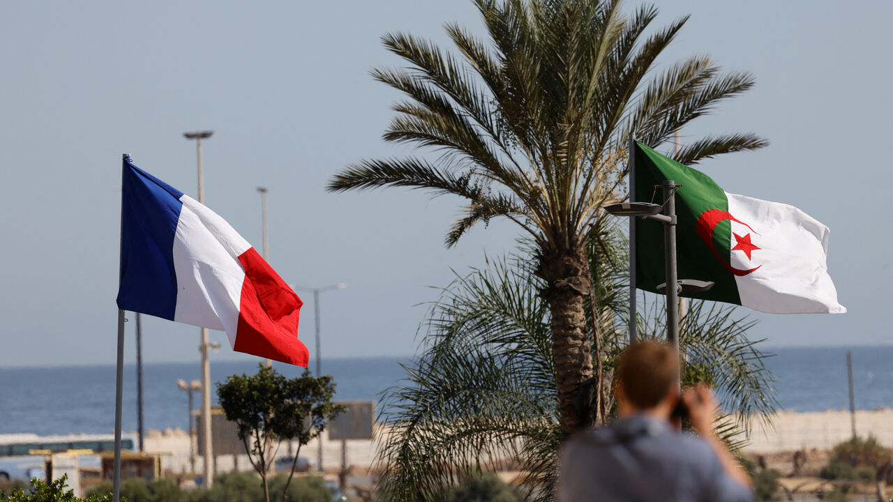 This picture taken on Aug. 25, 2022 shows the France flag and Algeria flag ahead of the arrival of French President in Algiers for an official visit. 