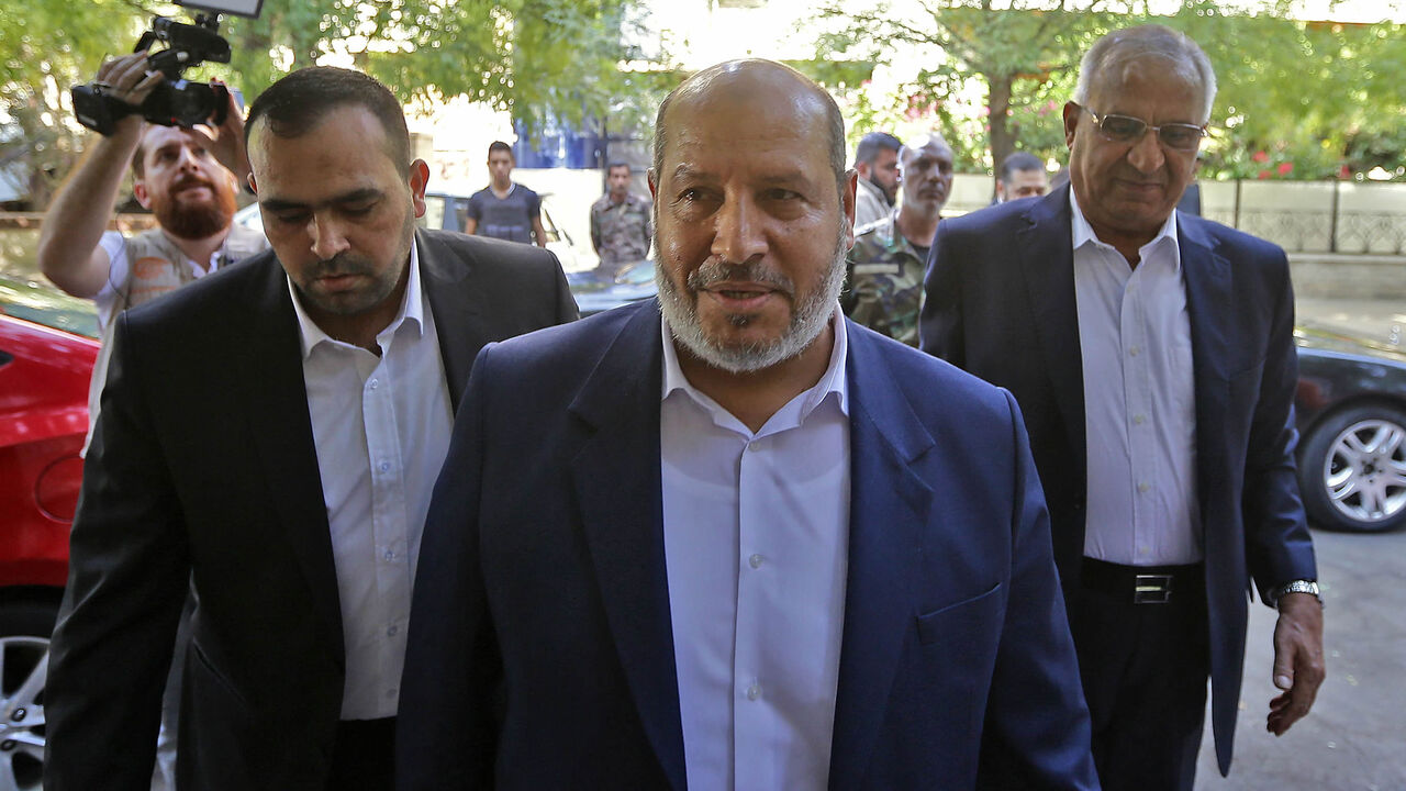 Hamas's chief representative in Lebanon Osama Hamdan (L), Hamas Arab relations chief Khalil al-Hayya (C) and Secretary-General of the Popular Front for the Liberation of Palestine-General Command Talal Naji arrive for a press conference during a visit to Damascus, Syria, Oct. 19, 2022.