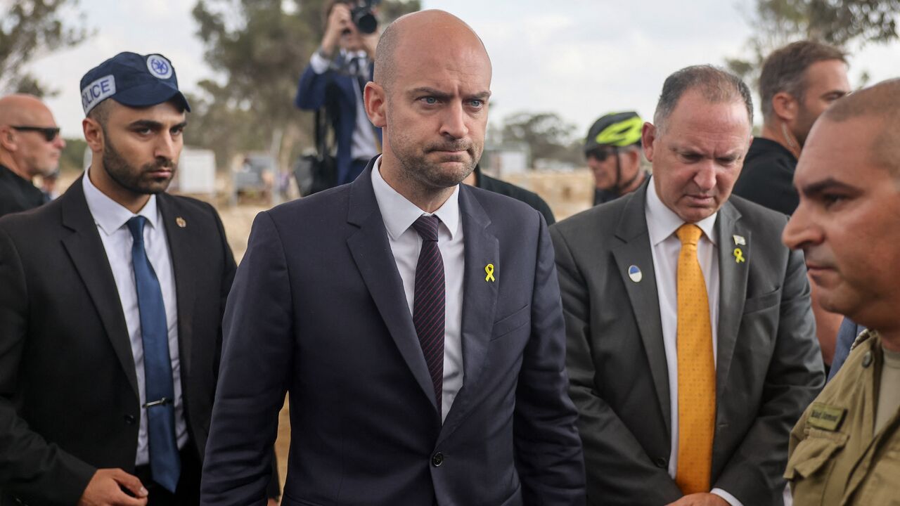 French Minister for Europe and Foreign Affairs Jean-Noel Barrot (C) visits the Nova festival memorial.