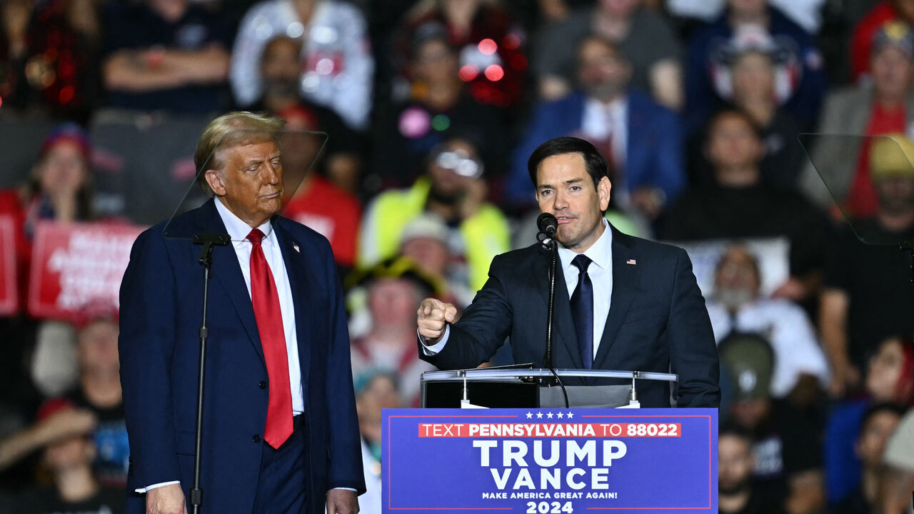 US Senator Marco Rubio, Republican of Florida, speaks next to former US President and Republican presidential candidate Donald Trump during a campaign rally at the PPL Center in Allentown, Pennsylvania, on October 29, 2024. (Photo by ANGELA WEISS / AFP) (Photo by ANGELA WEISS/AFP via Getty Images)