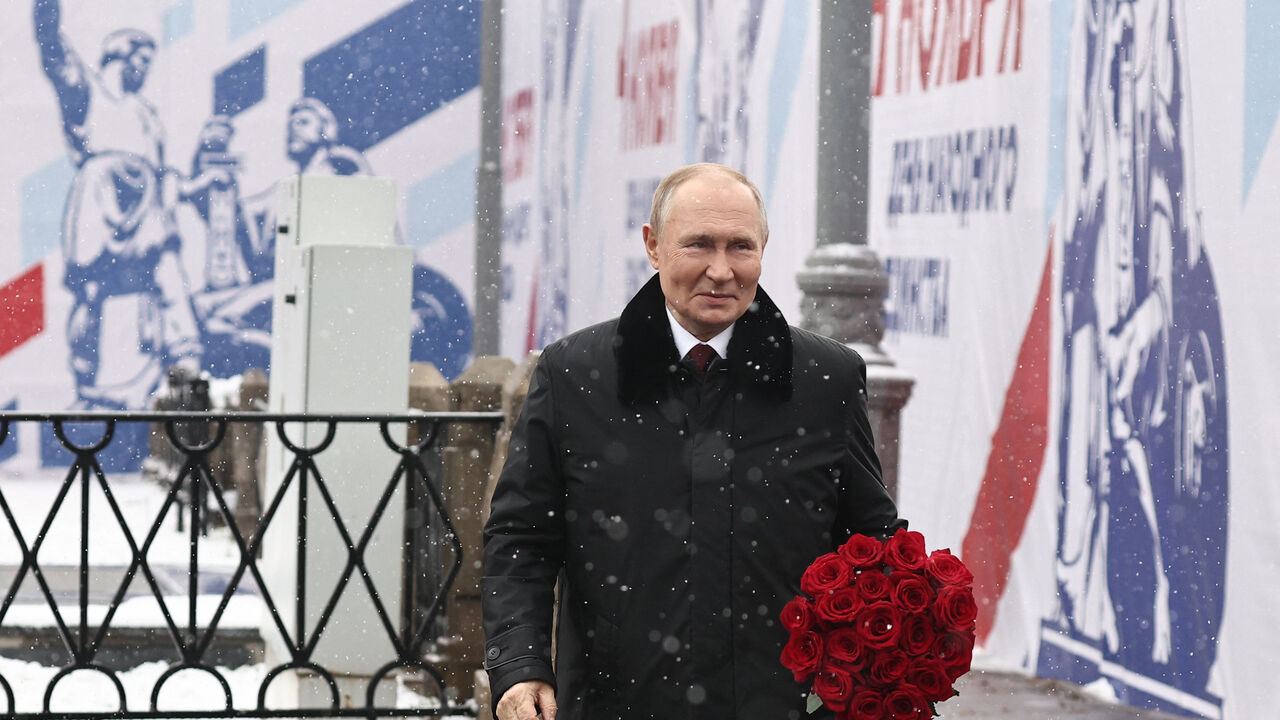 In this pool photograph distributed by Russian state agency Sputnik, Russia's President Vladimir Putin attends a flower-laying ceremony at the Monument to Minin and Pozharsky on Red Square on the National Unity Day in Moscow on November 4, 2024. (Photo by Mikhail TERESHCHENKO / POOL / AFP) (Photo by MIKHAIL TERESHCHENKO/POOL/AFP via Getty Images)