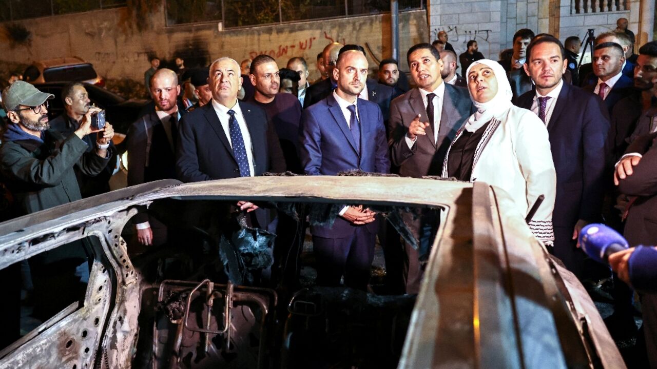 French Foreign Minister Jean-Noel Barrot (C) inspects cars torched in an attack by Israeli settlers on the West Bank town of Al-Bireh, adjacent to Ramallah French Foreign Minister Jean-Noel Barrot (C) inspects cars torched in an attack by Israeli settlers on the West Bank town of Al-Bireh, adjacent to Ramallah