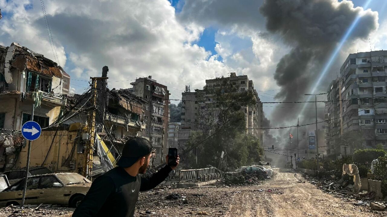 Smoke rises over south Beirut after an Israeli air strike. Smoke rises over south Beirut after an Israeli air strike.