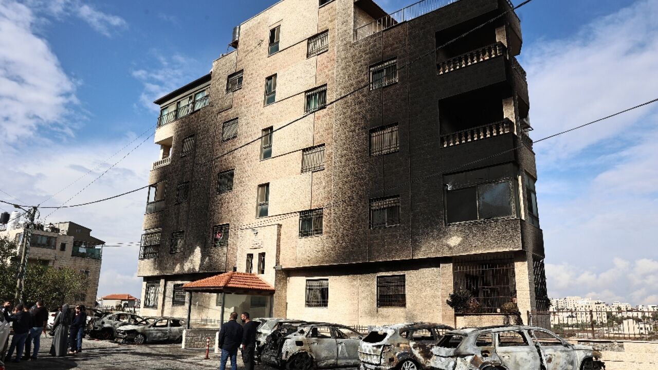 Aftermath of the settler attack: burned out cars and a building's scorched facade Aftermath of the settler attack: burned out cars and a building's scorched facade