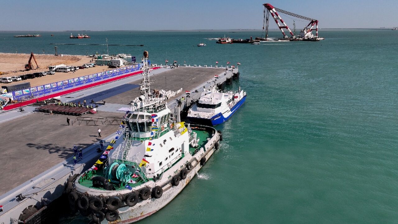 Boats sit at mooring at a newly inaugurated dock in Grand Faw Port, a multi-billion dollar mega-project on Iraq's Gulf coast. Boats sit at mooring at a newly inaugurated dock in Grand Faw Port, a multi-billion dollar mega-project on Iraq's Gulf coast.