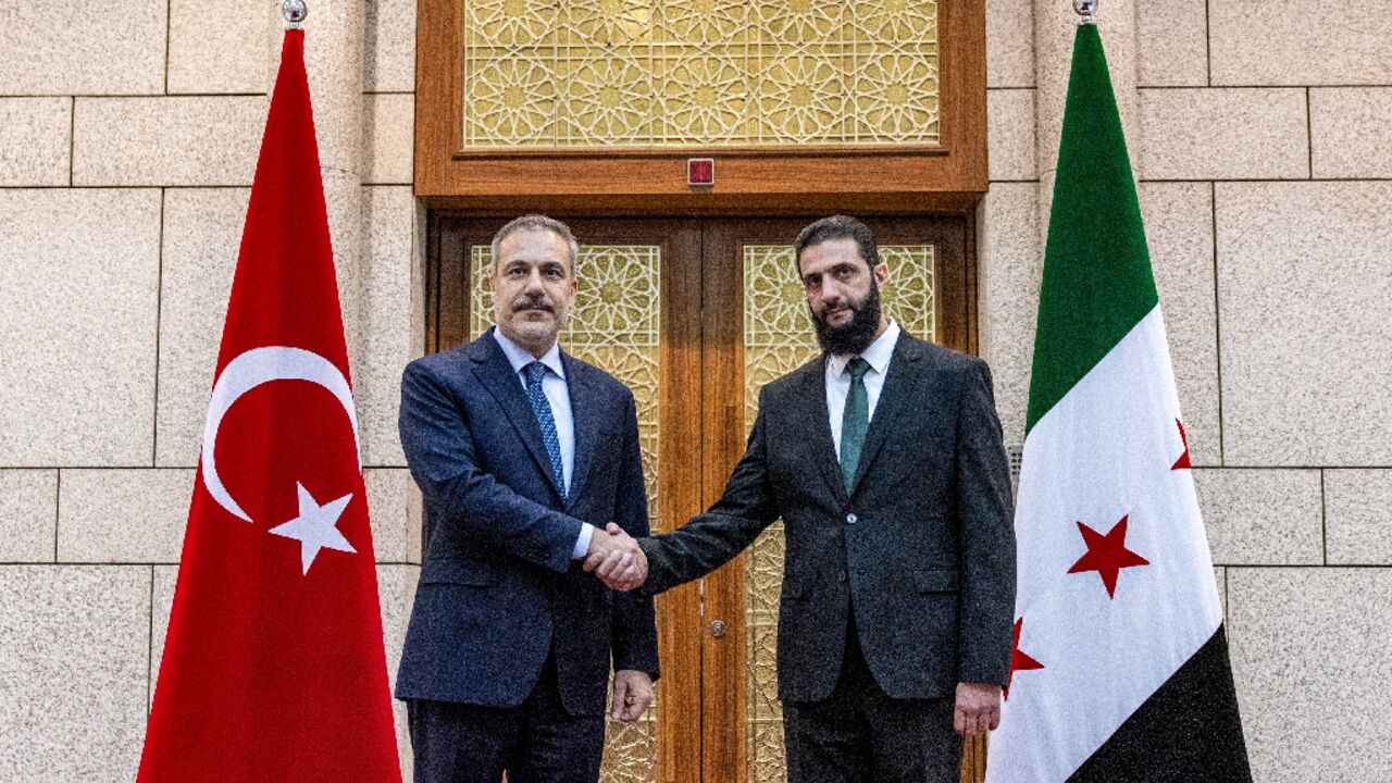 During a press conference with Turkey's Foreign Minister Hakan Fidan (L), Syria's new leader Ahmed al-Sharaa (R) said all weapons must be under state control, including those from 'revolutionary' and Kurdish-led factions During a press conference with Turkey's Foreign Minister Hakan Fidan (L), Syria's new leader Ahmed al-Sharaa (R) said all weapons must be under state control, including those from 'revolutionary' and Kurdish-led factions